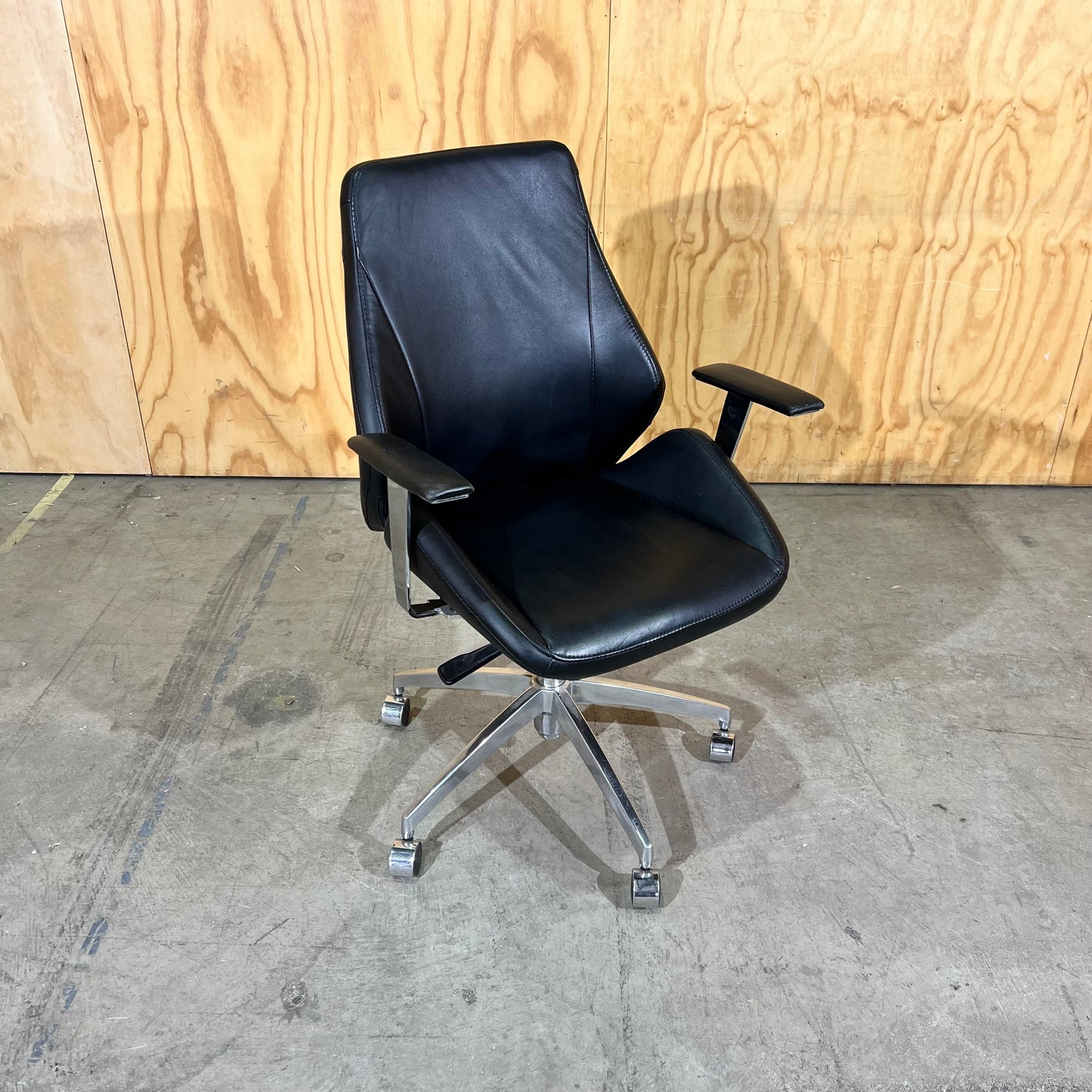 Black leather executive chair with arms
