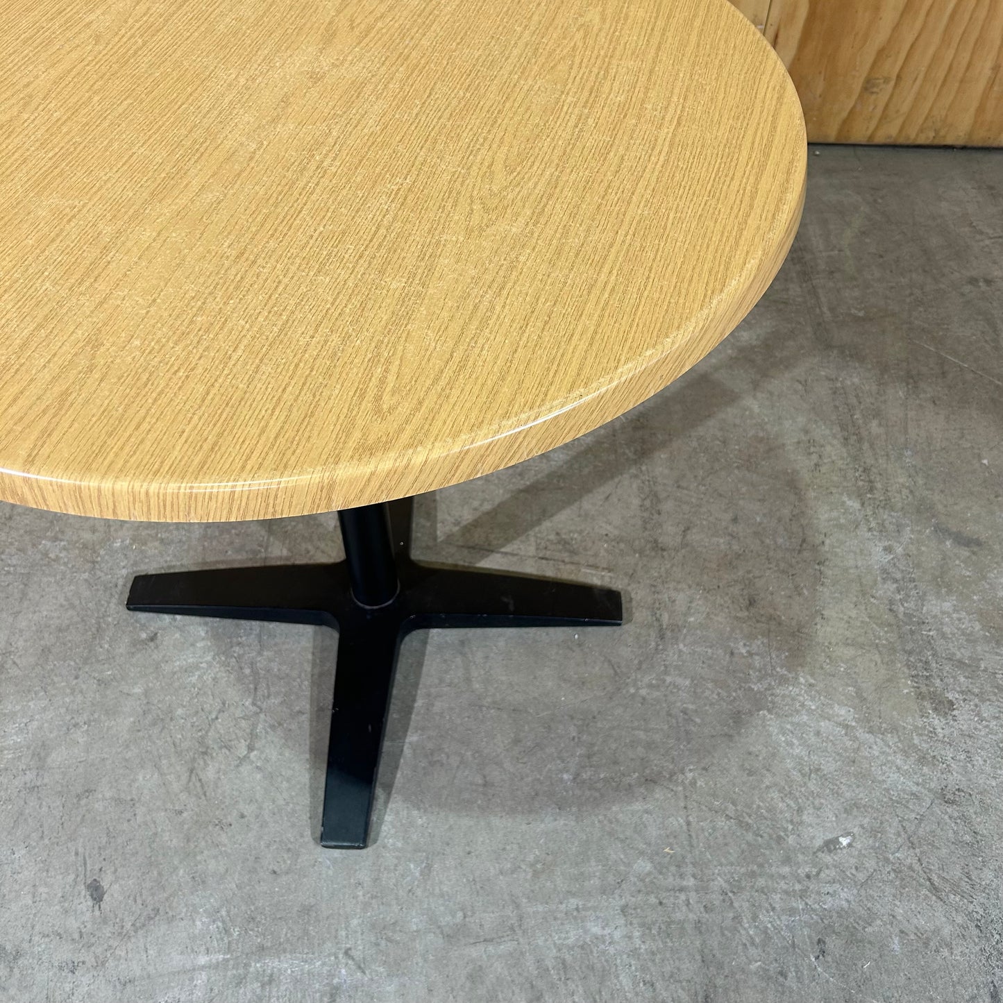 Round Timber Laminate Table with Black Metal Base