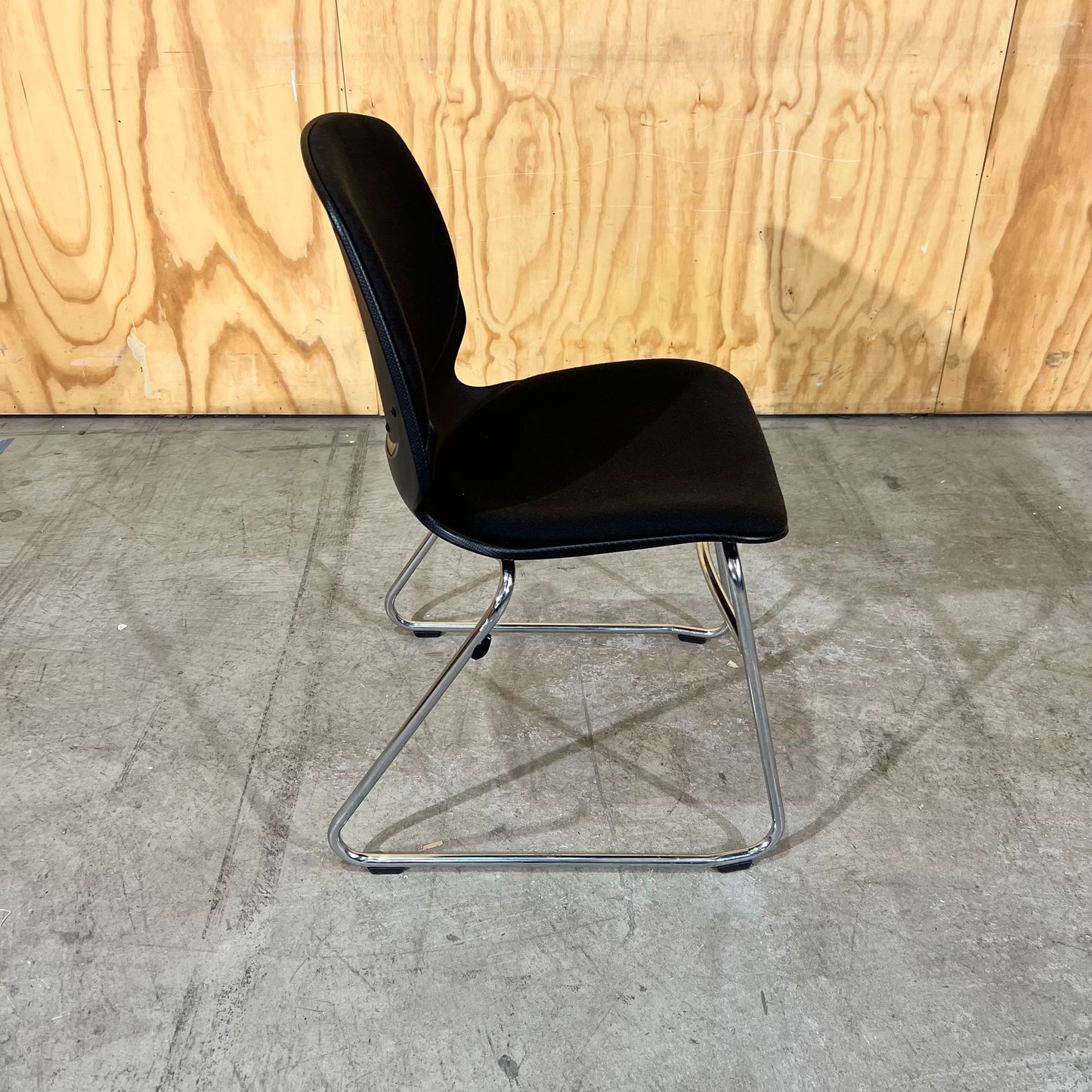 Black fabric and moulded plastic visitors chair