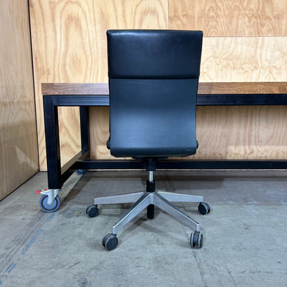 Timber table on black metal frame with castors