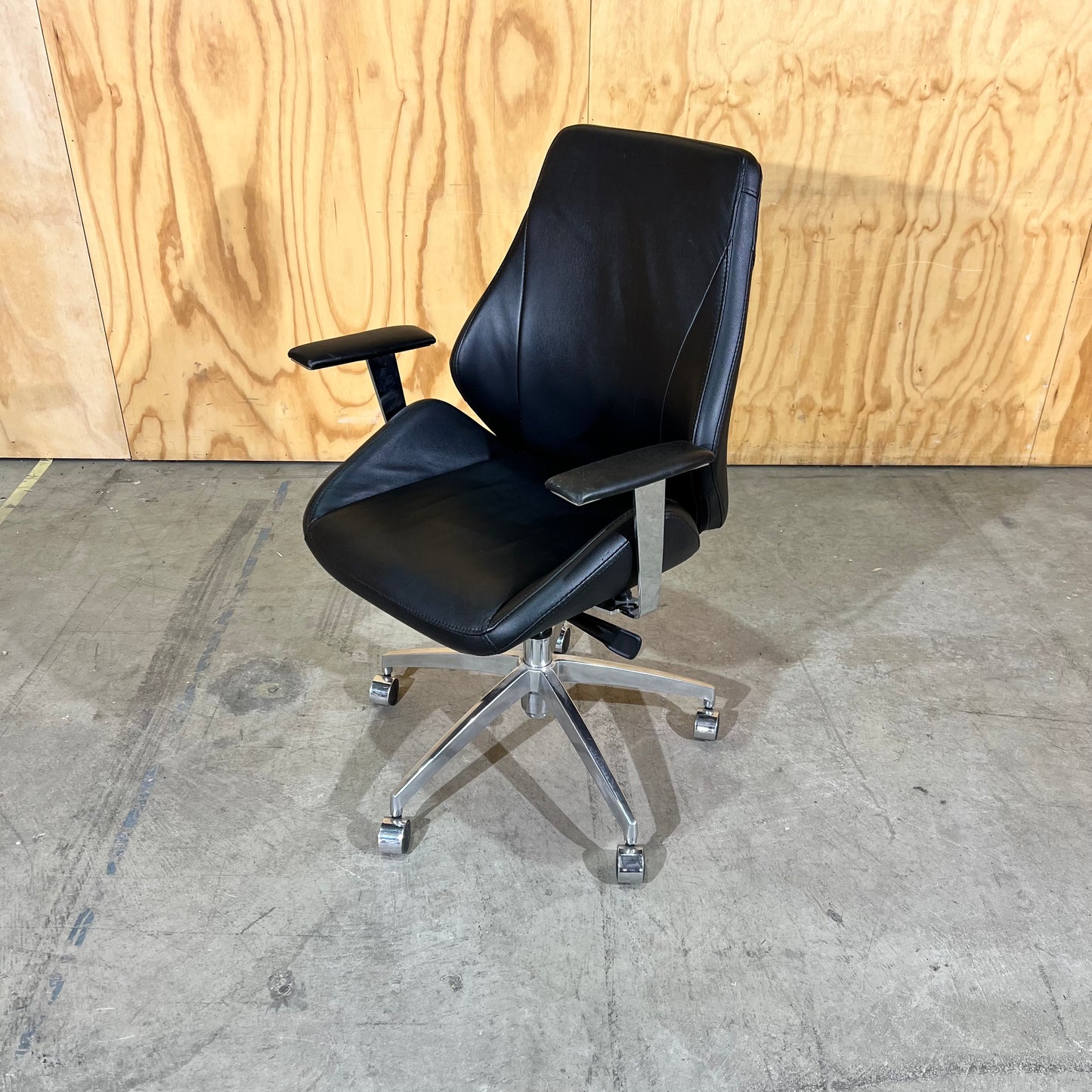 Black leather executive chair with arms
