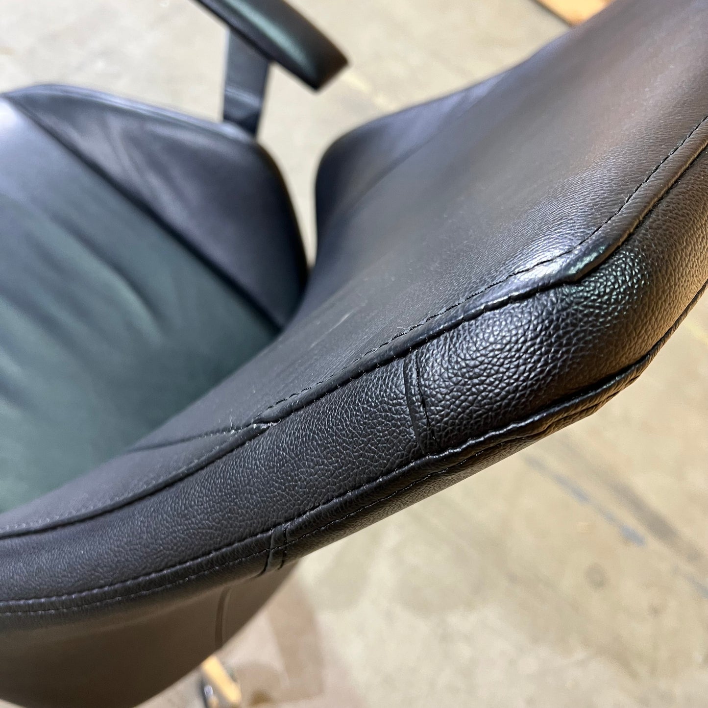Black leather executive chair with arms