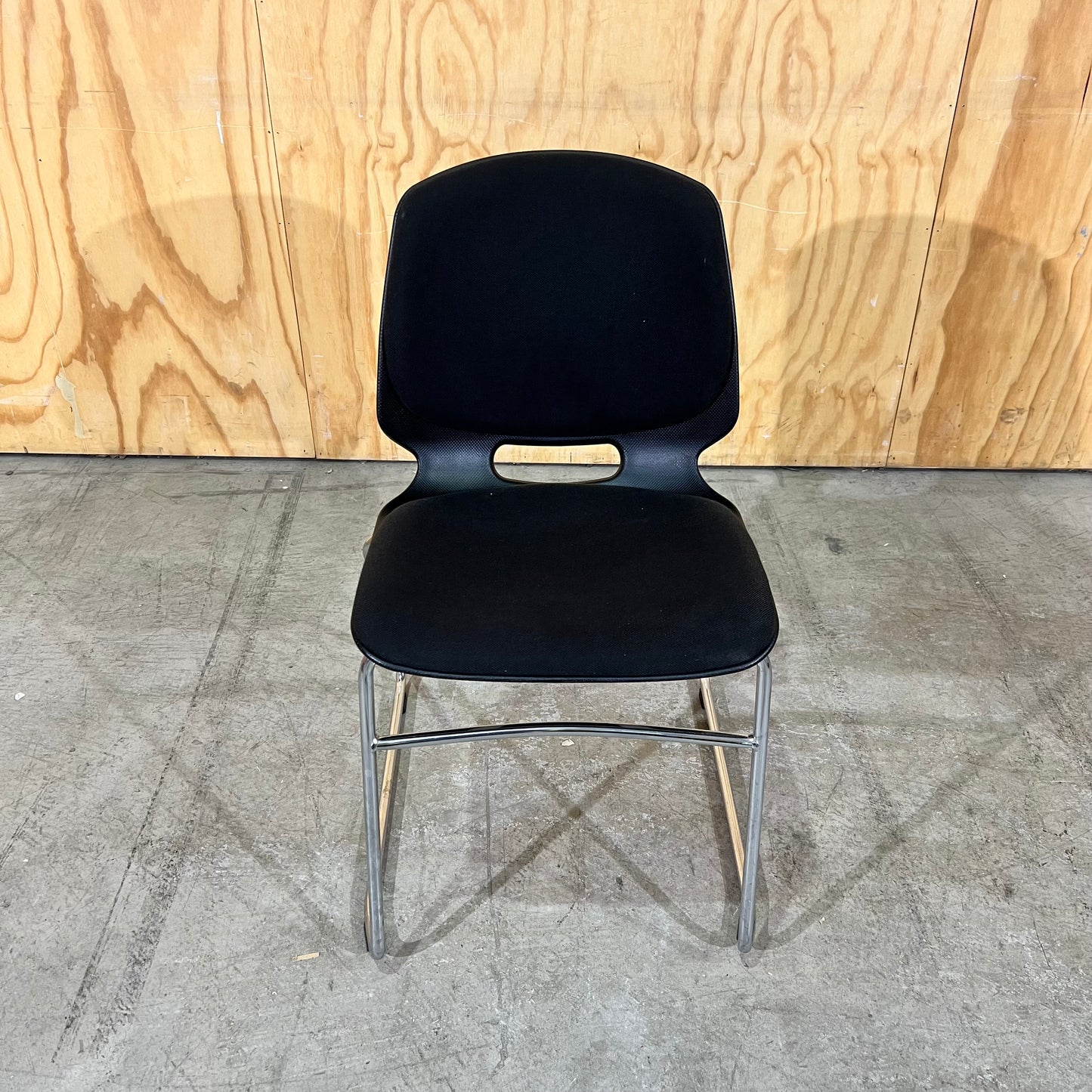 Black fabric and moulded plastic visitors chair
