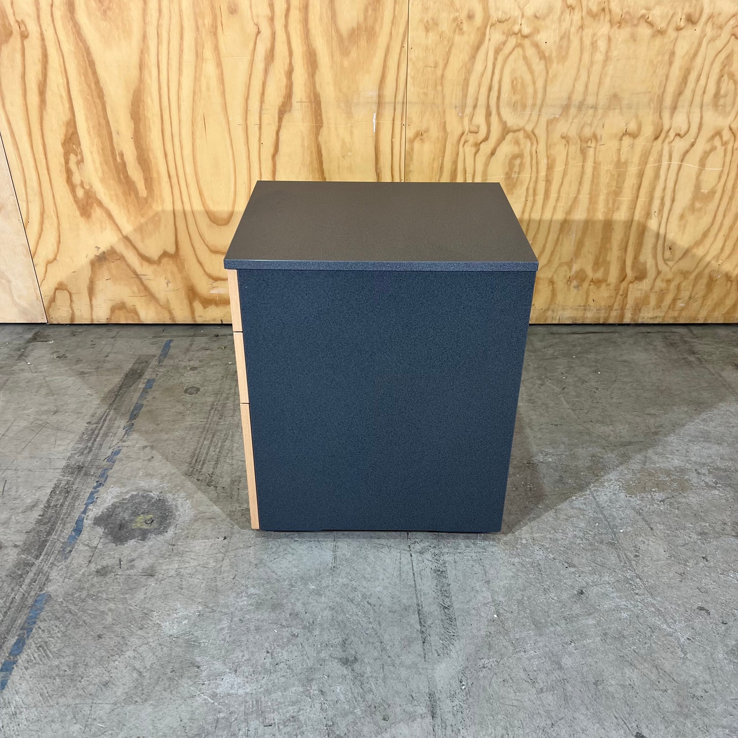 Charcoal and tan pedestal