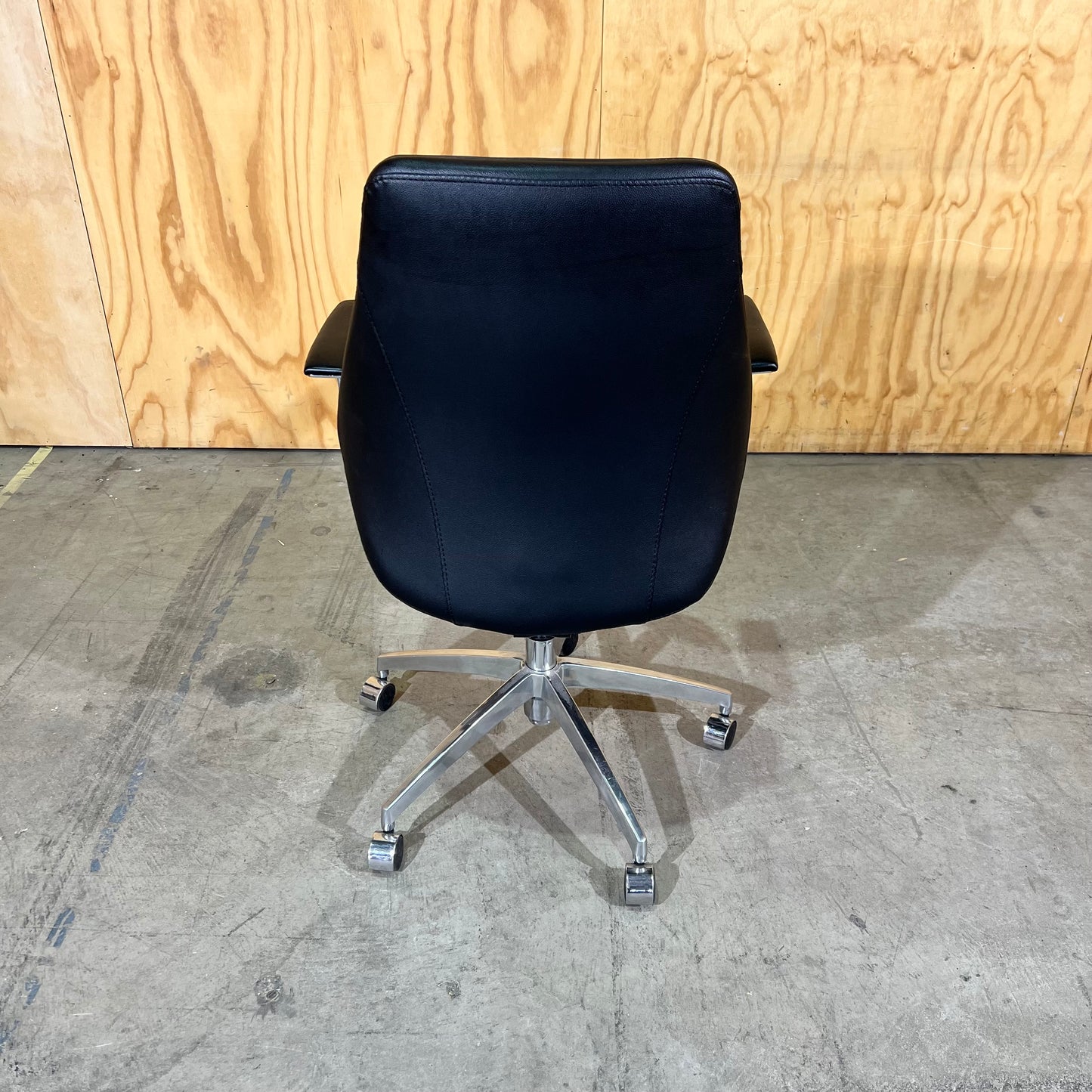 Black leather executive chair with arms