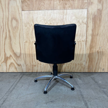 Black faux leather swivel chair on chrome base by Pago