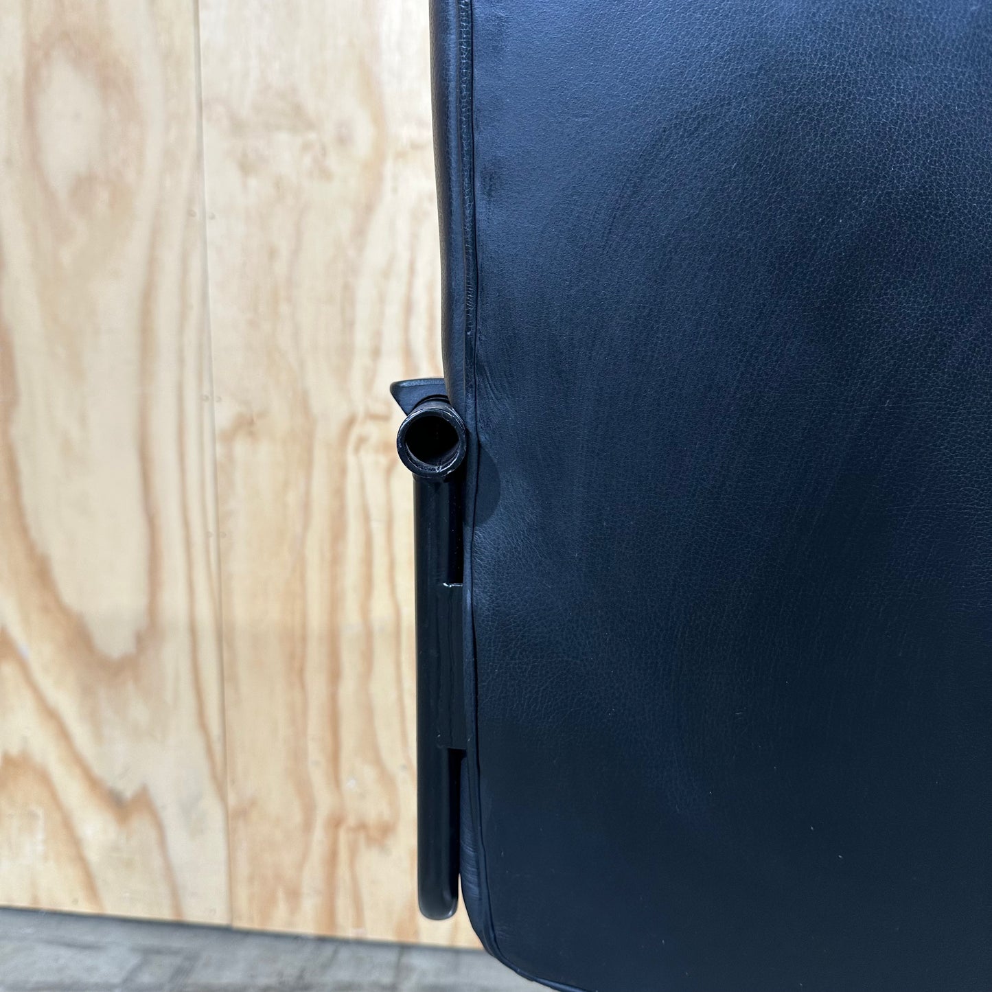 Black faux leather swivel chair on chrome base by Pago