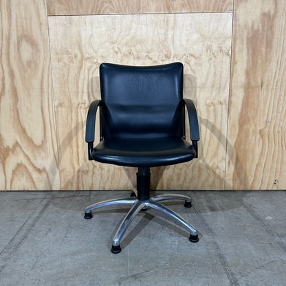 Black faux leather swivel chair on chrome base by Pago