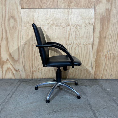 Black faux leather swivel chair on chrome base by Pago