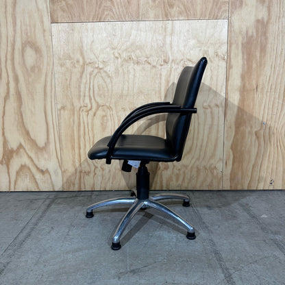 Black faux leather swivel chair on chrome base by Pago