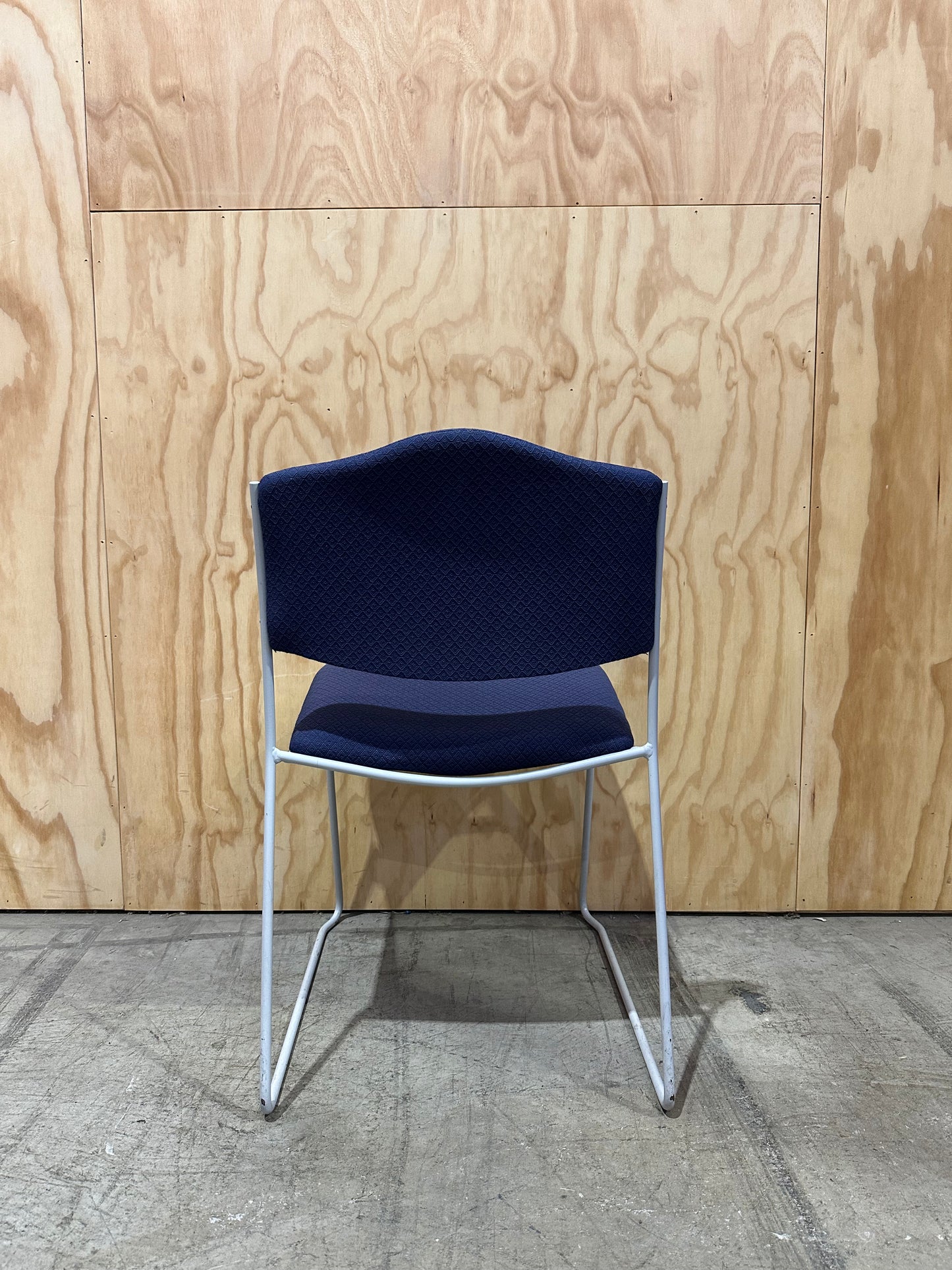 Blue Patterned Waiting Room Chair on White Sled Legs