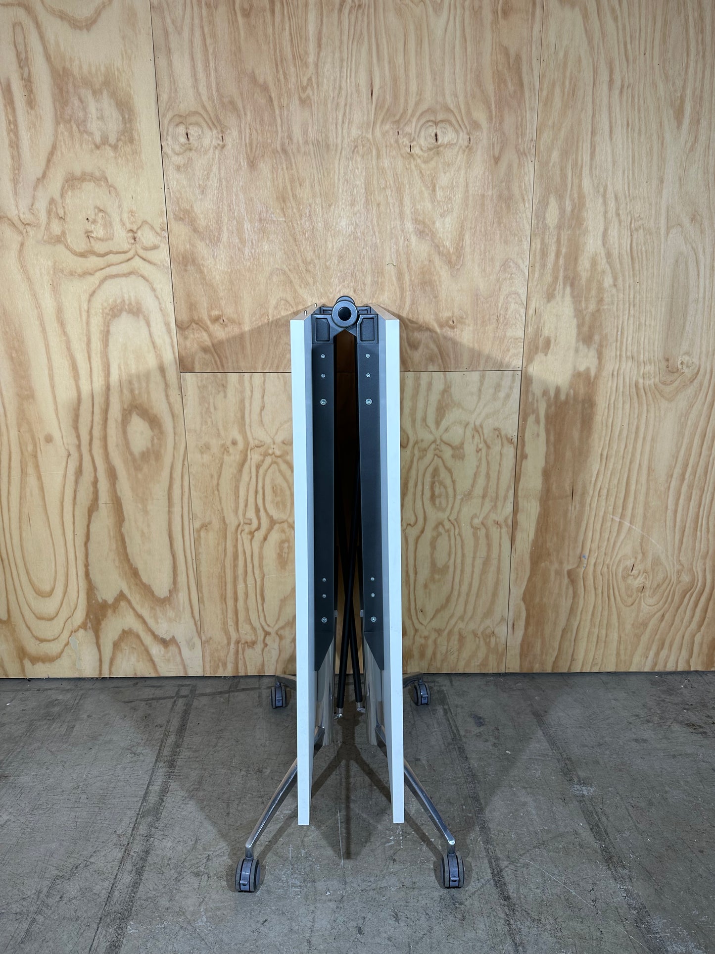 White folding table on castors