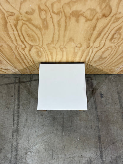 Square white top coffee table on brown legs