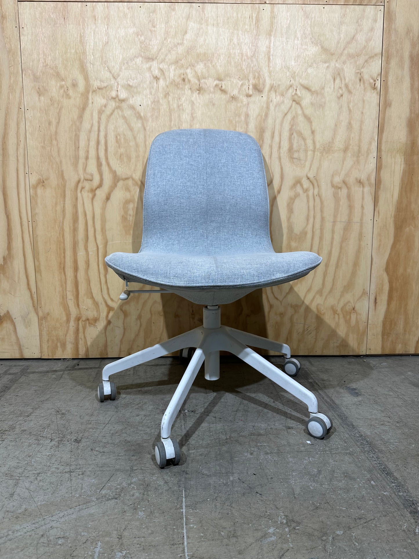 Light grey office swivel chair on castors