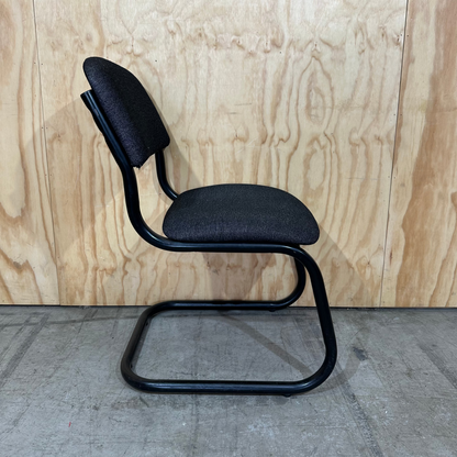 Upholstered grey cantilever chair