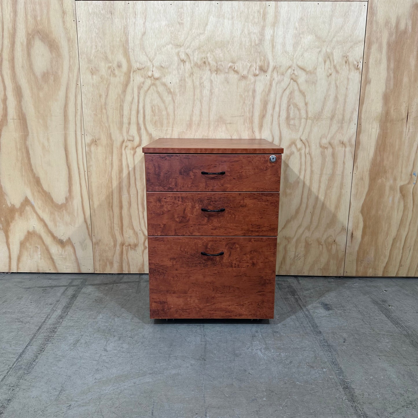 Wood veneer three drawer pedestal