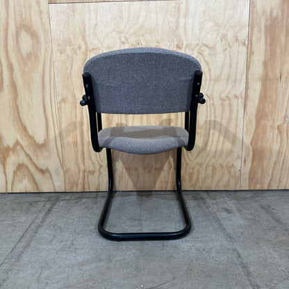 Light grey cantilever visitor chair with black frame
