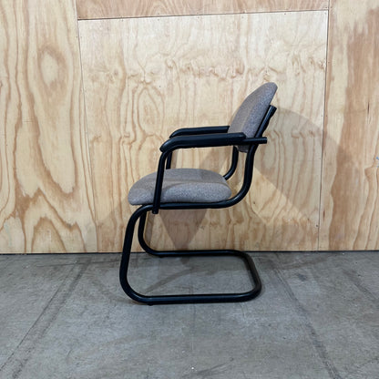 Light grey cantilever visitor chair with black frame