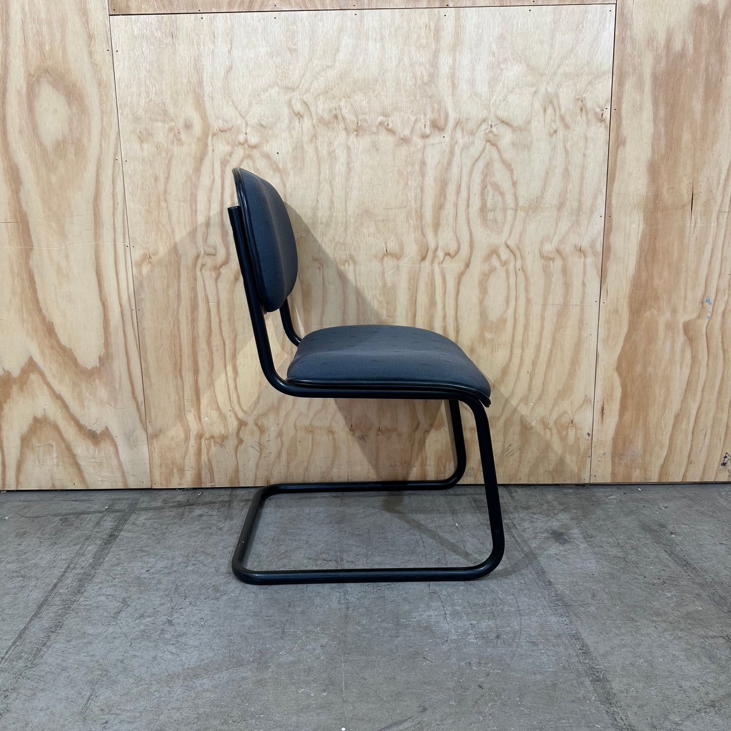 Navy upholstered sled base visitor chair