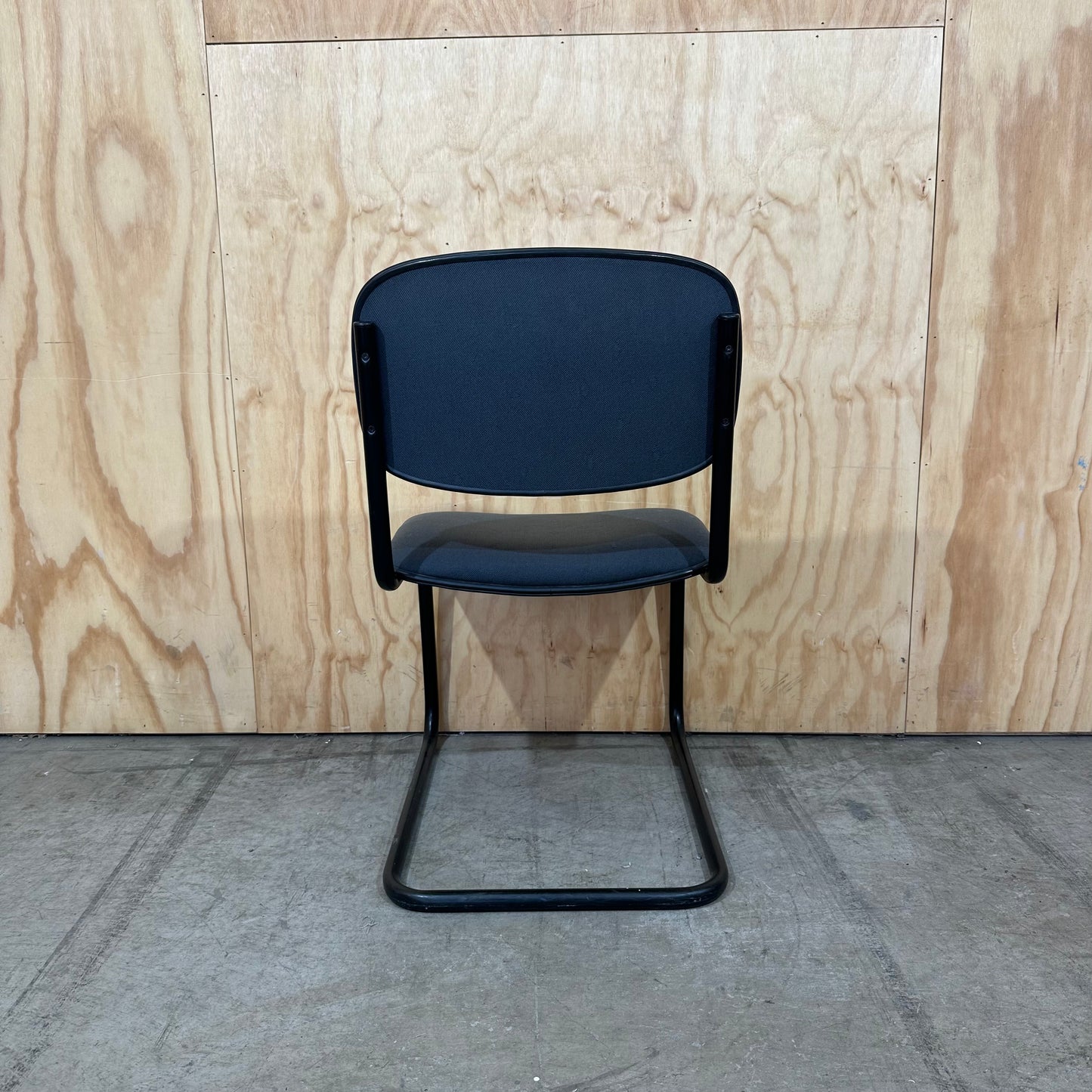 Navy upholstered sled base visitor chair