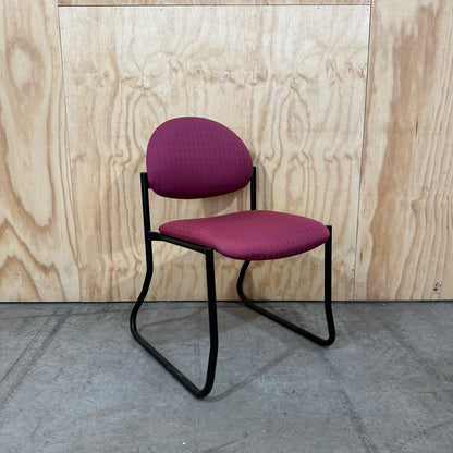 Red upholstered sled chair