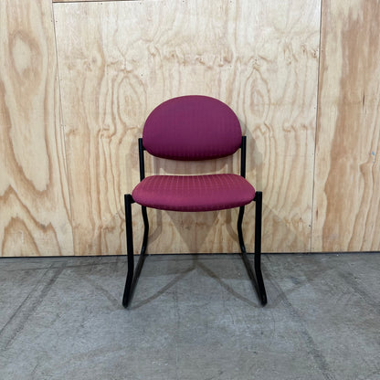 Red upholstered sled chair