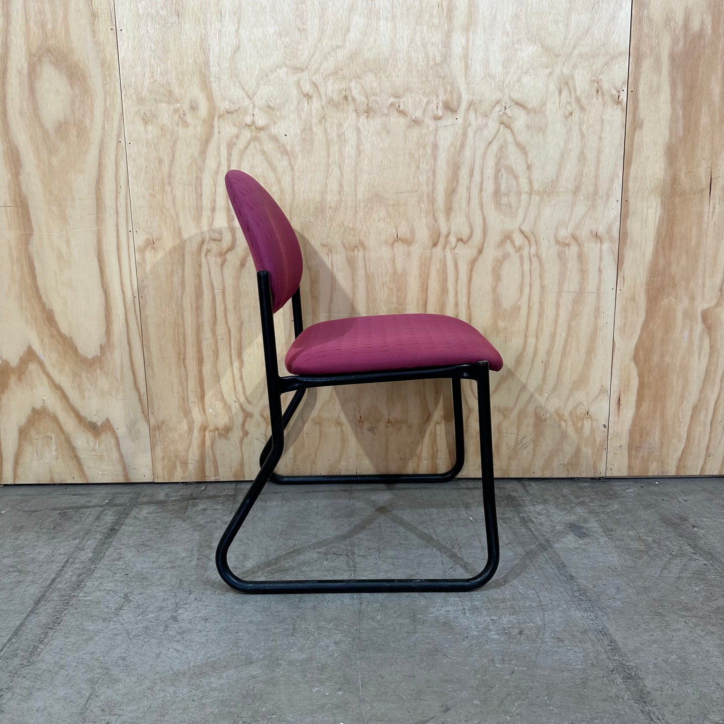 Red upholstered sled chair