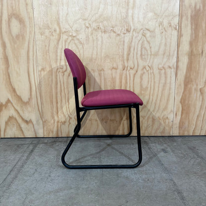 Red upholstered sled chair