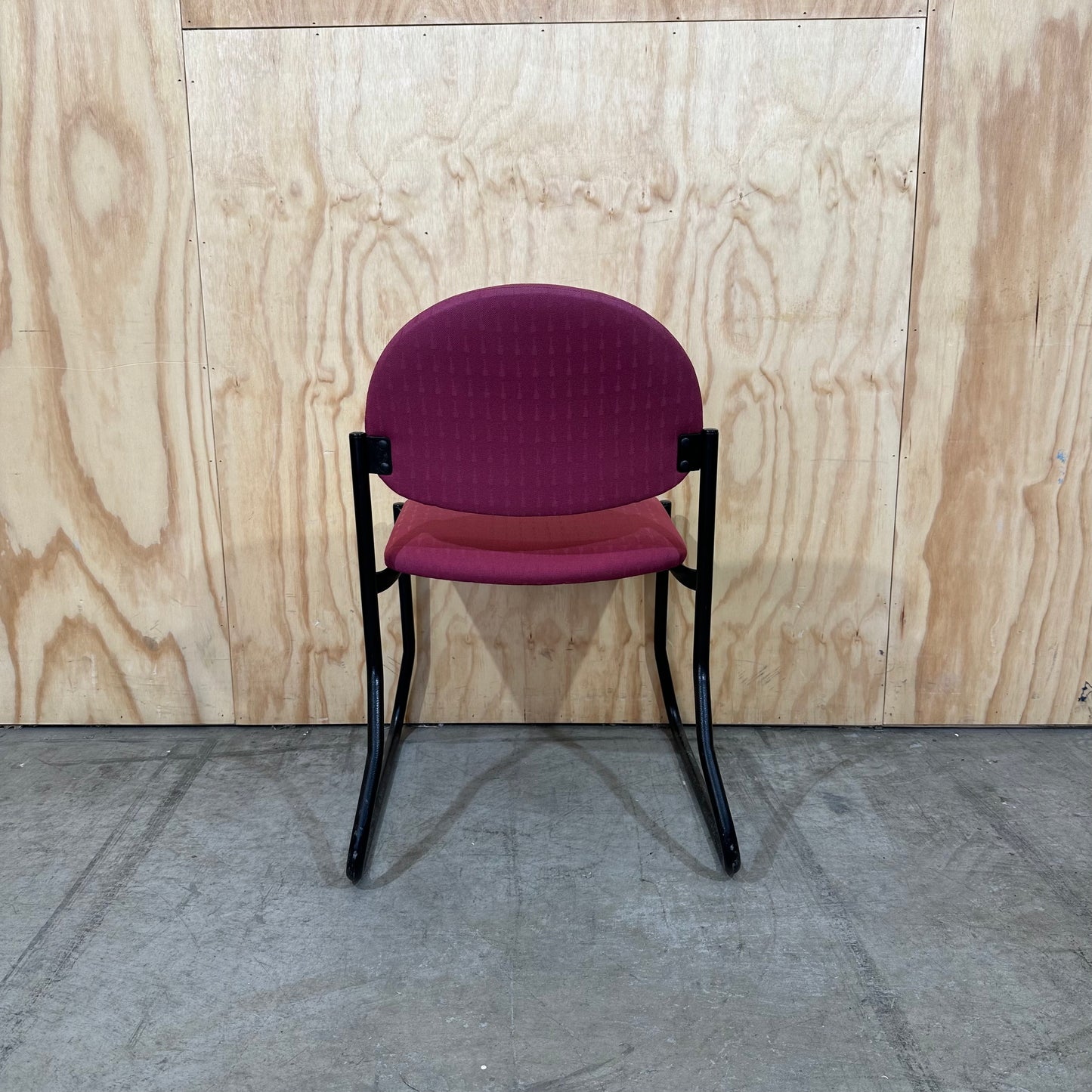 Red upholstered sled chair