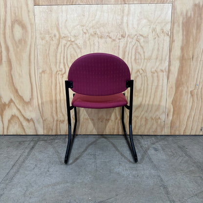 Red upholstered sled chair