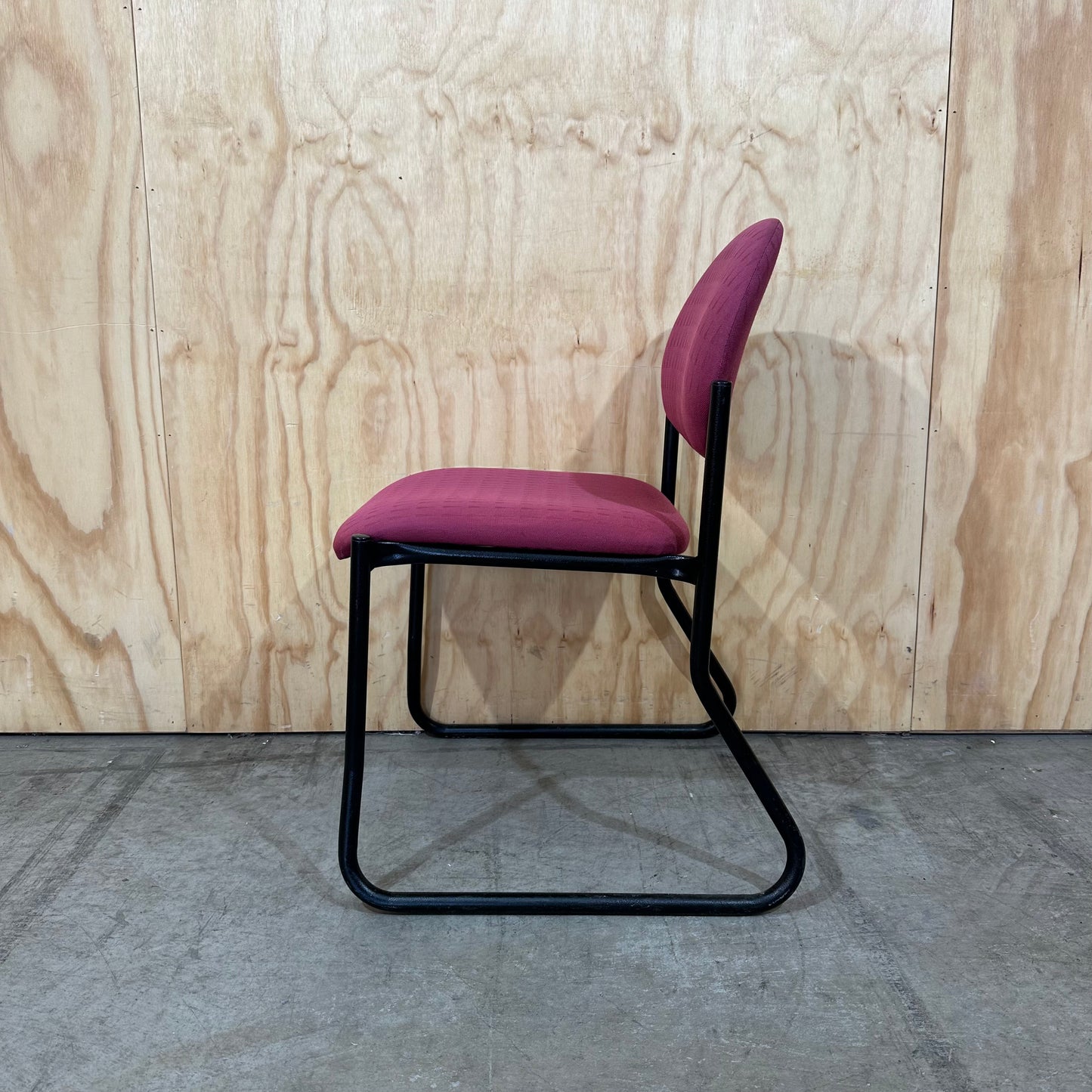 Red upholstered sled chair