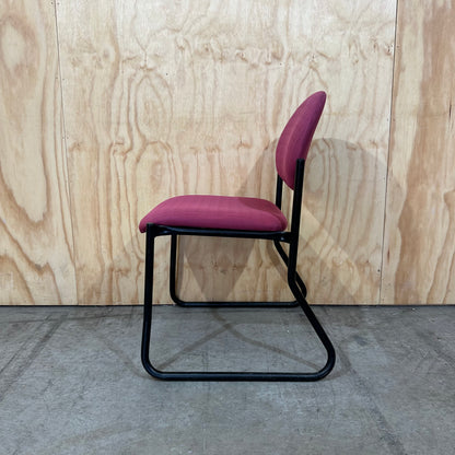 Red upholstered sled chair