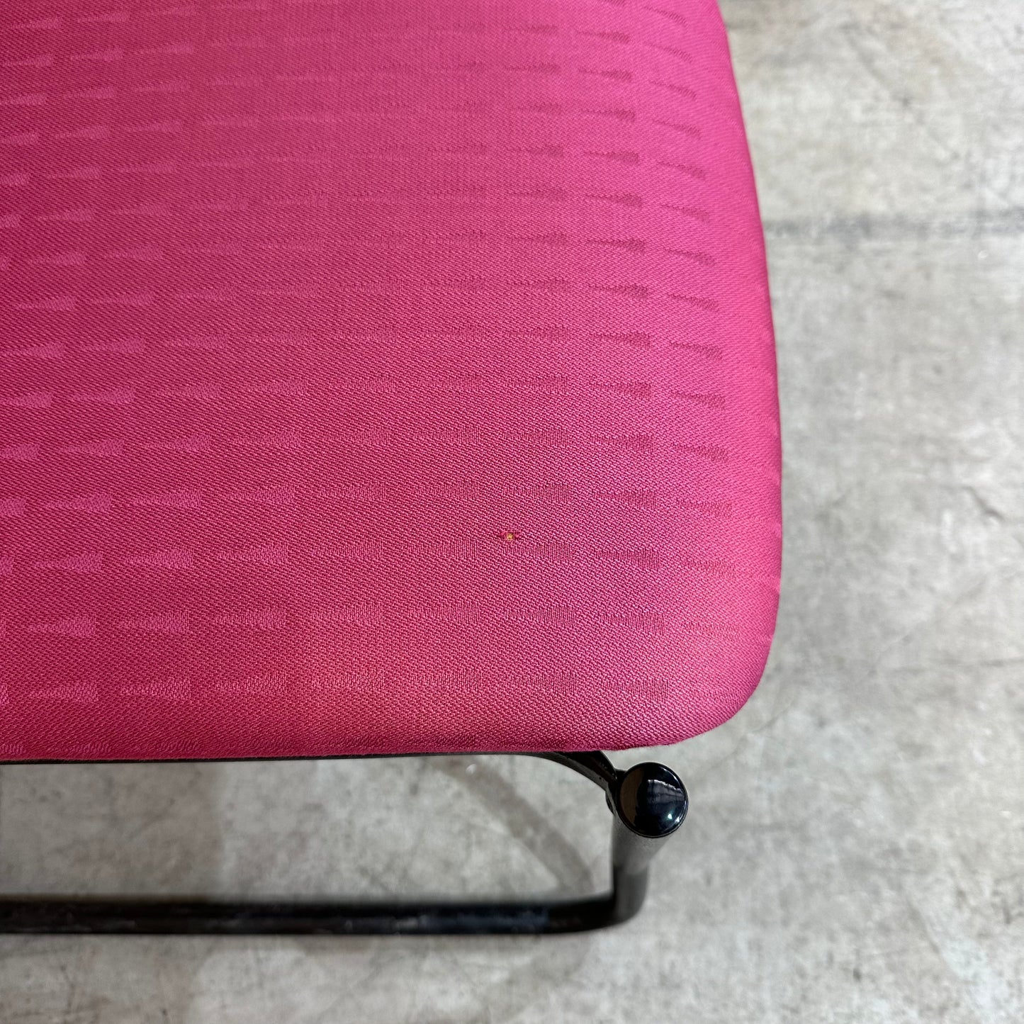 Red upholstered sled chair
