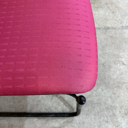 Red upholstered sled chair