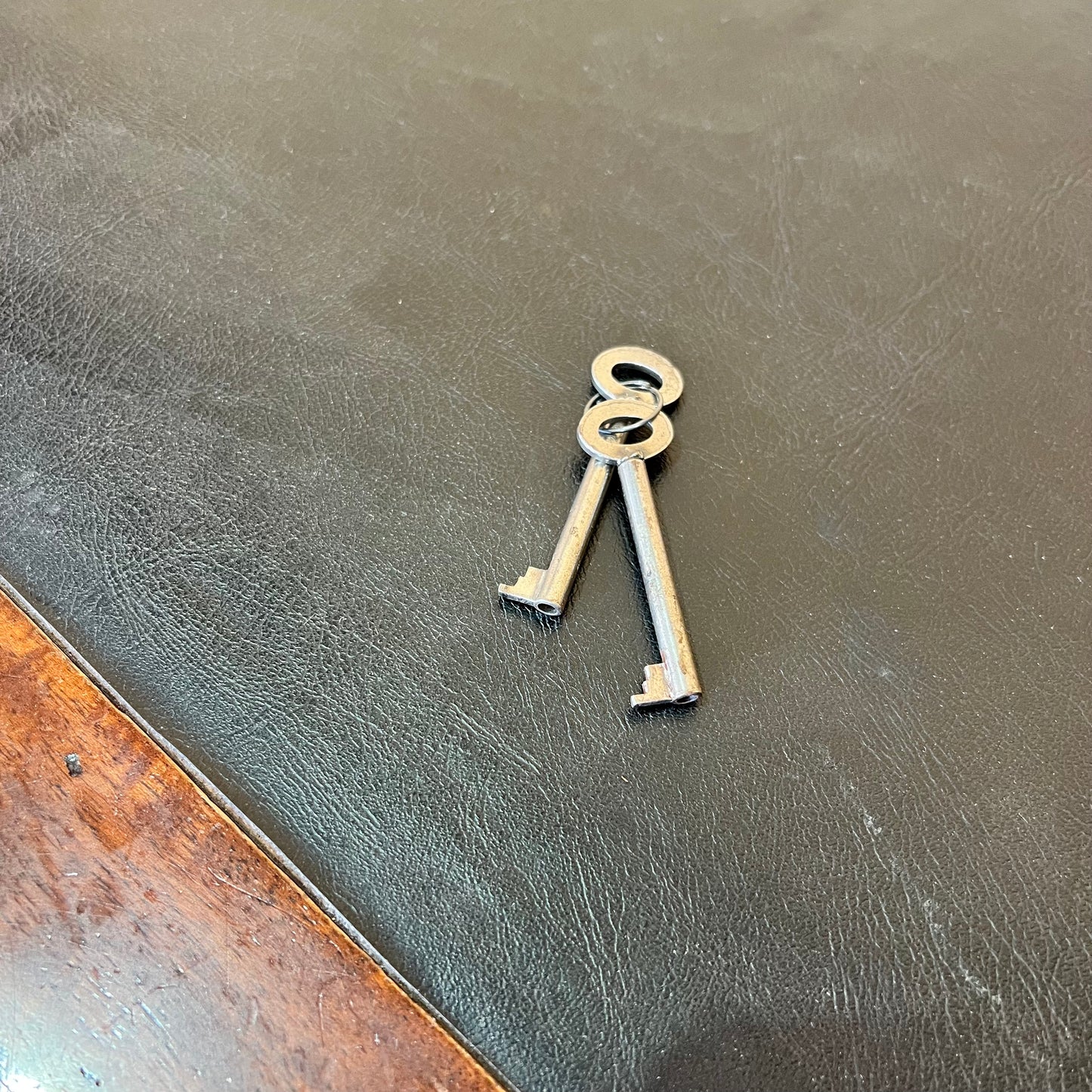 Antique timber executive desk with black leather top