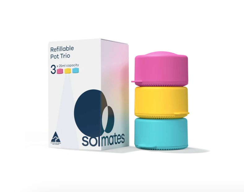 A Solmates refillable pot trio set, featuring a white box with pink and blue gradient accents alongside three stacked, colorful silicone pots in pink, yellow, and blue on a white background.