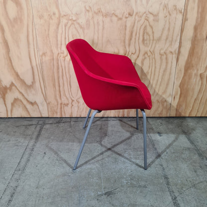 Red tub chair on grey metal legs