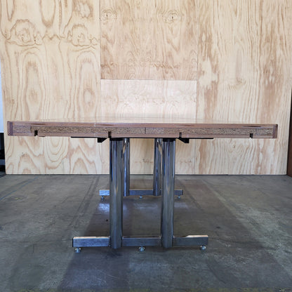 Timber veneer meeting table on chrome steel legs