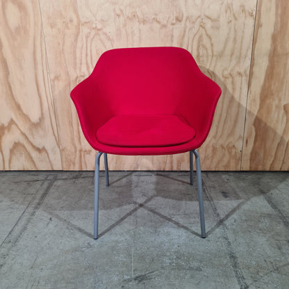 Red tub chair on grey metal legs