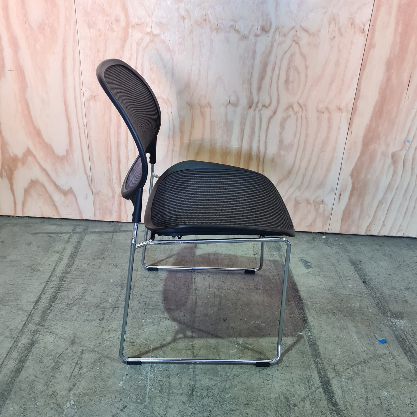 Black stacking chair with mesh back