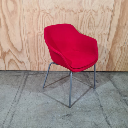 Red tub chair on grey metal legs