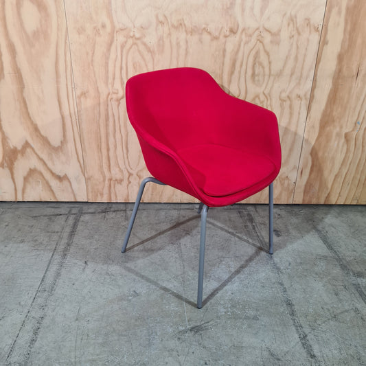 Red tub chair on grey metal legs