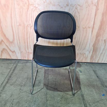 Black stacking chair with mesh back